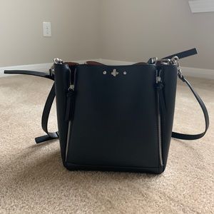 A bucket bag with zips